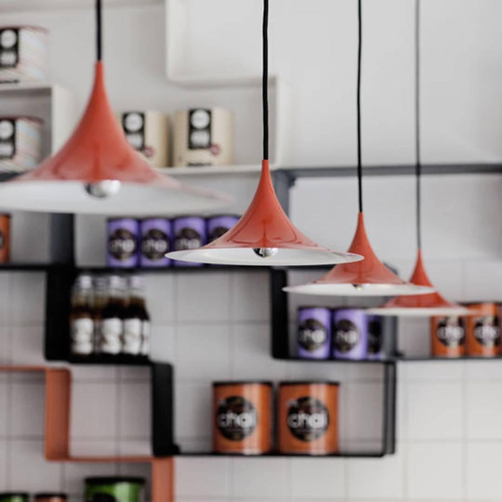 Arch pendant light grouped over a kitchen island