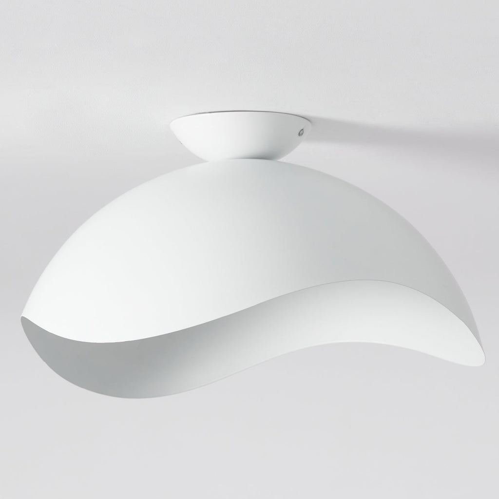 On a plain grey backdrop, this Clérachic wave ceiling light appears unlit, its smooth curve catching the light.