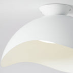 Close-up of the flowing wave-shaped shade on this Clérachic ceiling light, warm light tracing its curved edge.