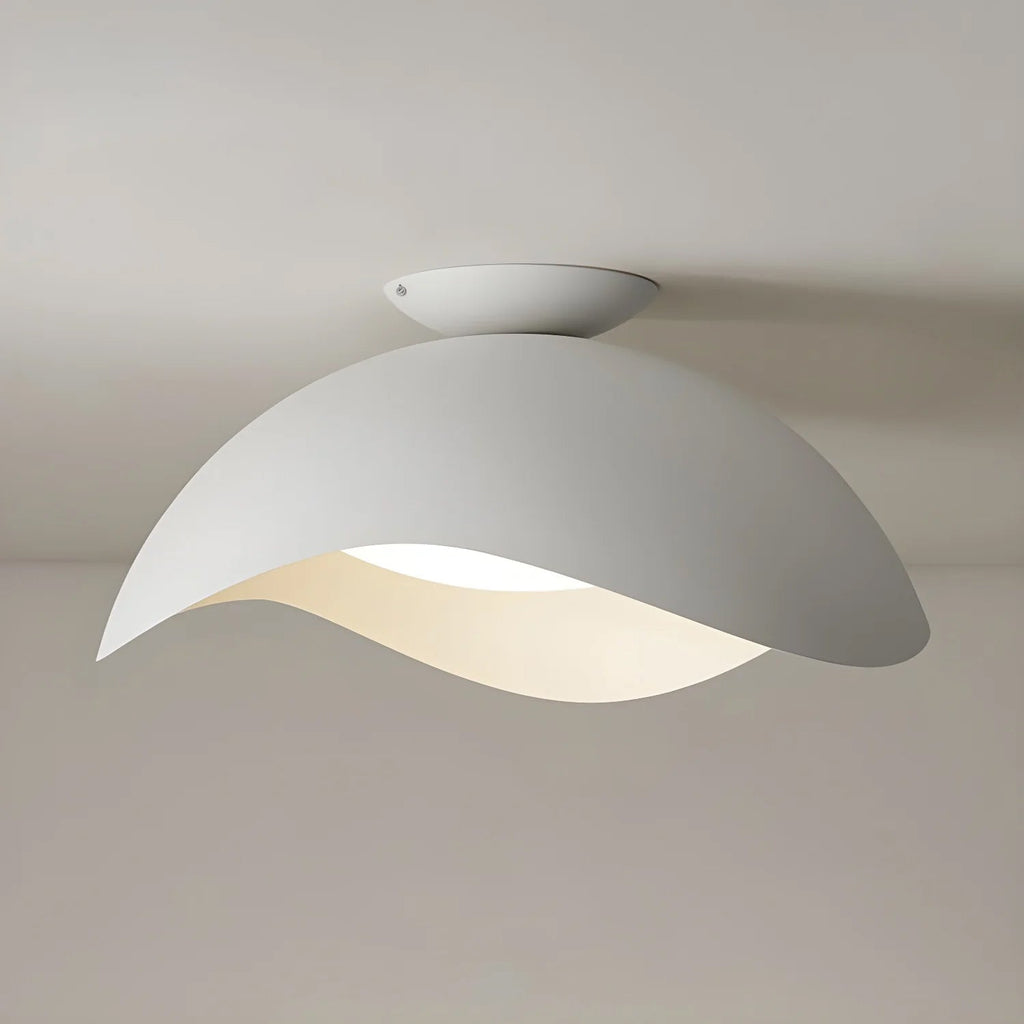 This Clérachic ceiling light in white hangs with its oval canopy clearly visible against a pale grey ceiling.