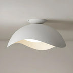 This Clérachic ceiling light in white hangs with its oval canopy clearly visible against a pale grey ceiling.