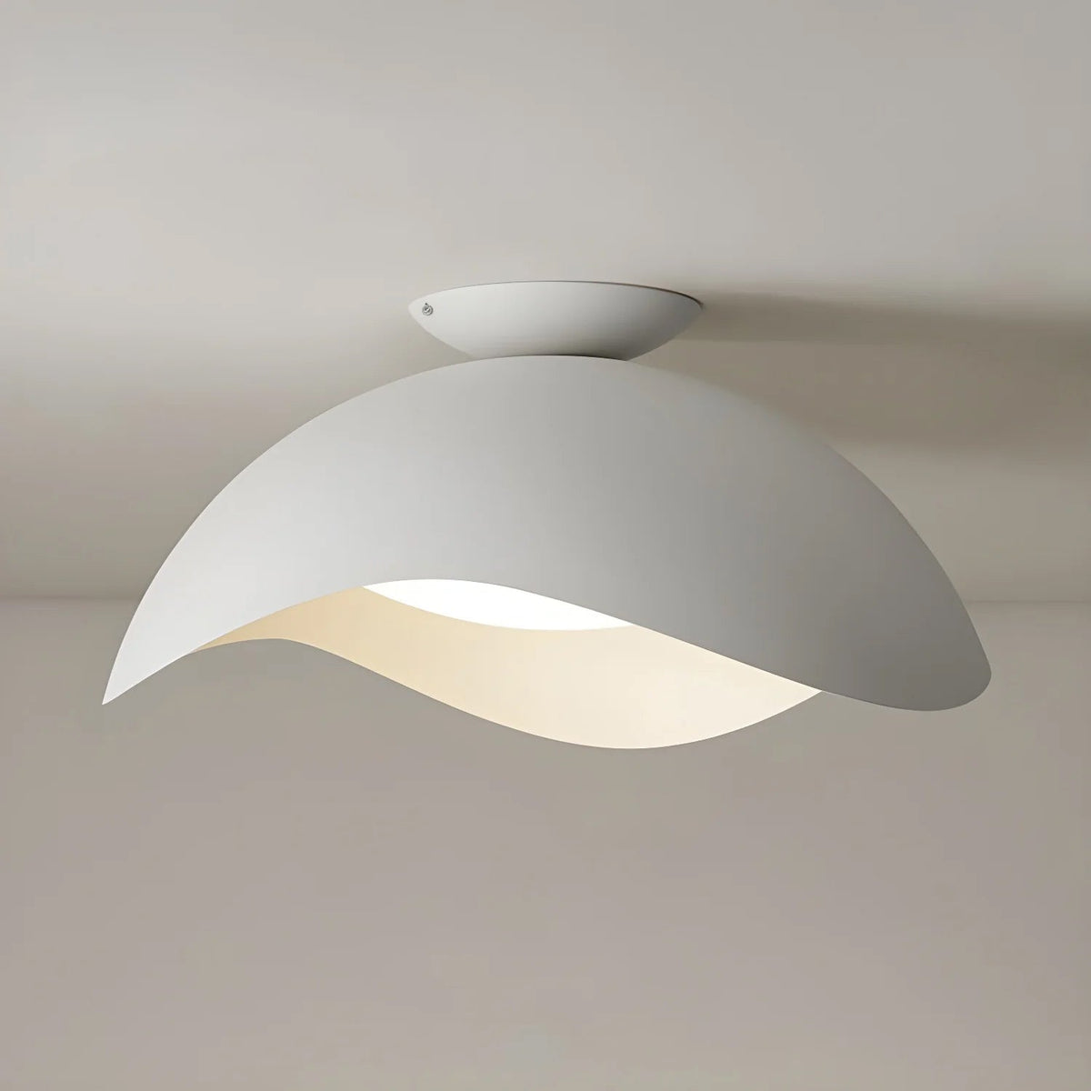 This Clérachic ceiling light in white hangs with its oval canopy clearly visible against a pale grey ceiling.