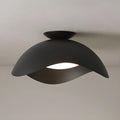 The matte black finish of this Clérachic ceiling light contrasts with its warm-lit shade underside.