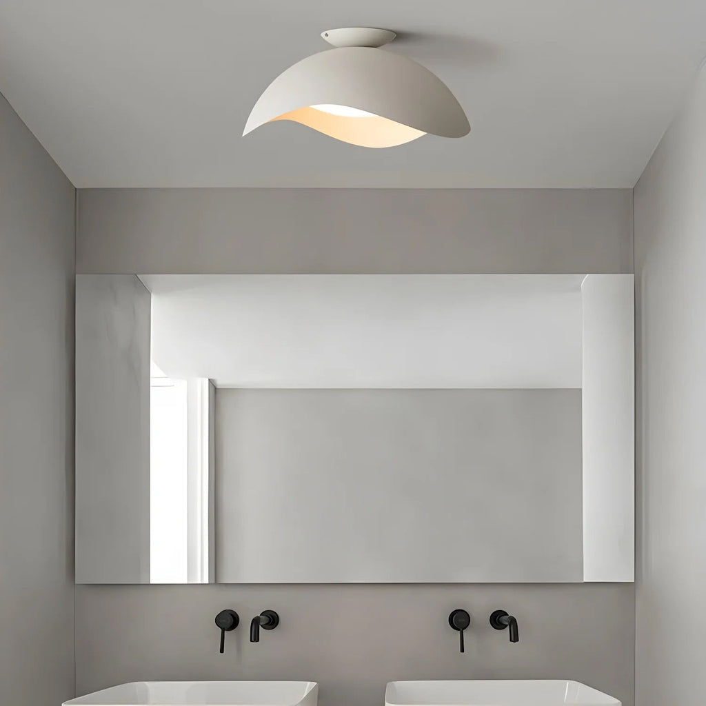 Above a bathroom mirror with matte black taps, this Clérachic ceiling light in white sits close to the ceiling.