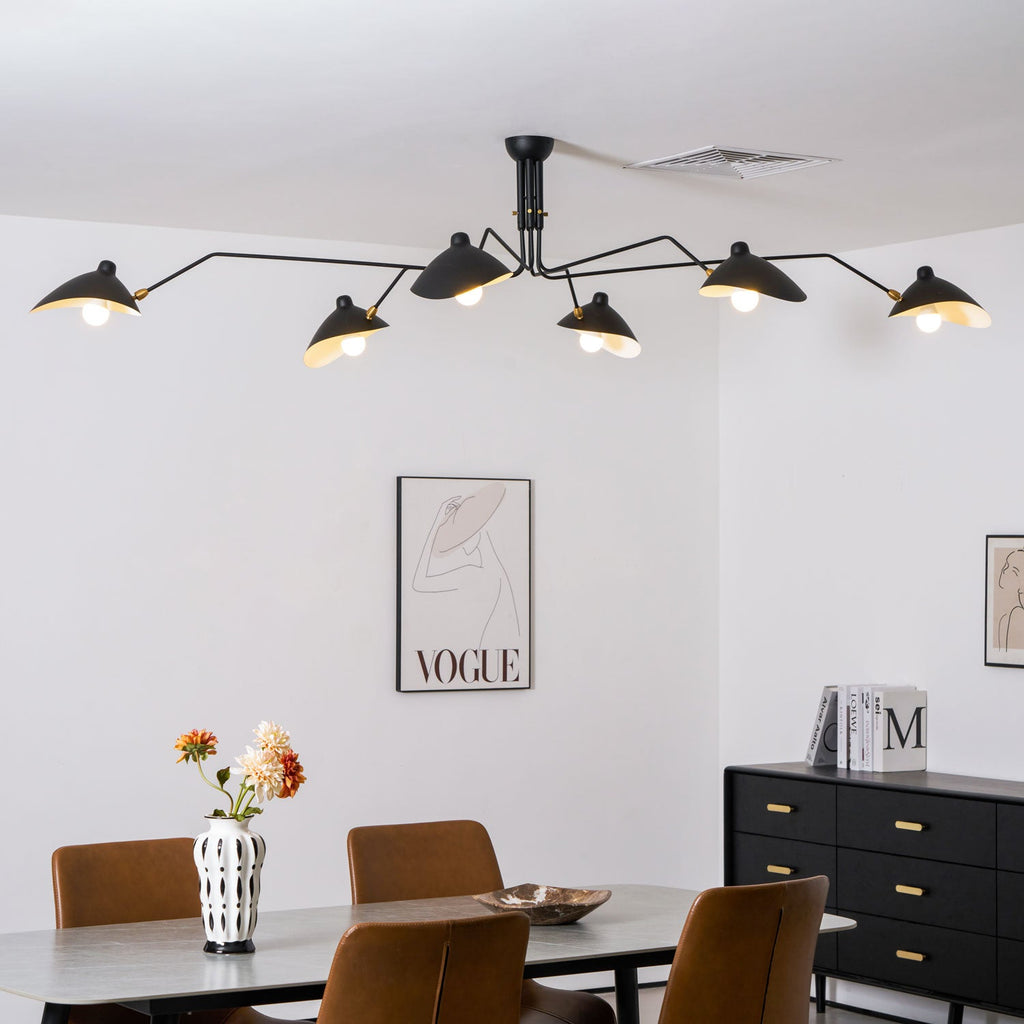 White multi-arm spider ceiling light in a bright room