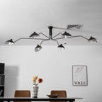 Suspended spider ceiling light glowing in a styled interior