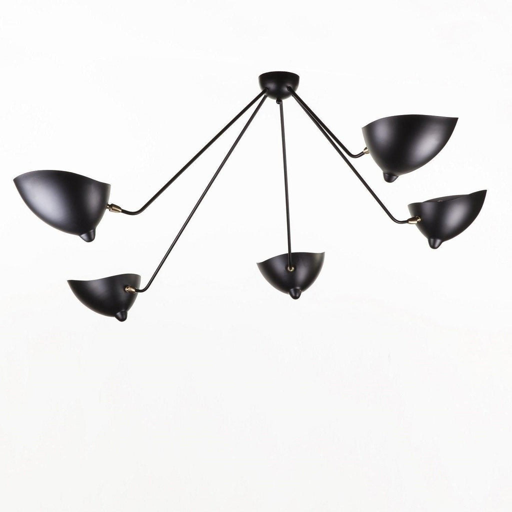 Five-arm spider ceiling light against a pale ceiling