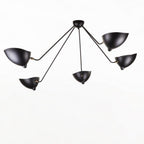 Five-arm spider ceiling light against a pale ceiling