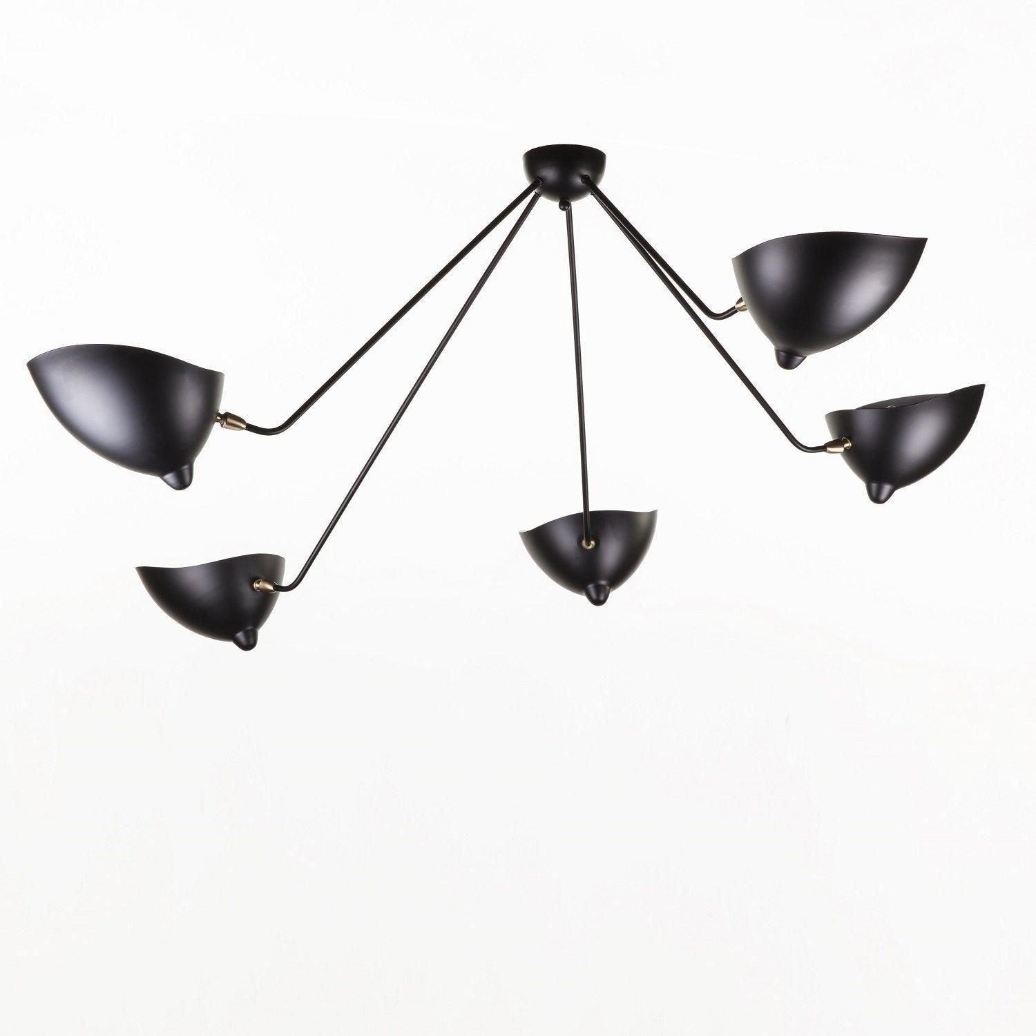 Five-arm spider ceiling light against a pale ceiling