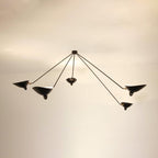 Five-arm spider ceiling light spreading wide across the ceiling