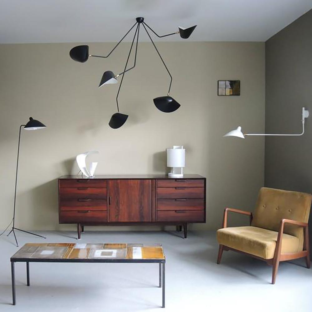 Spider ceiling lamp with delicate steel arms overhead