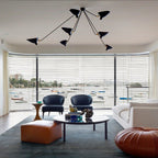 Spider ceiling light shown over a dining table