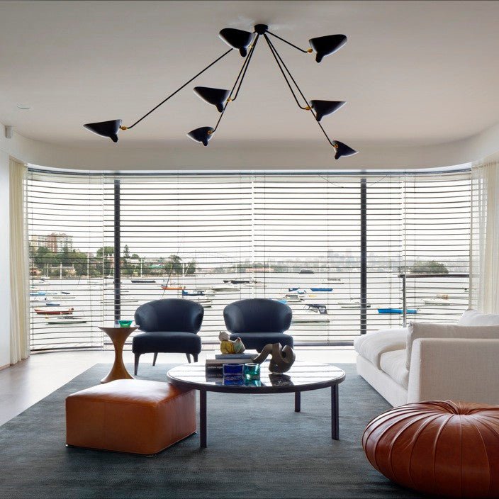 Spider ceiling light shown over a dining table
