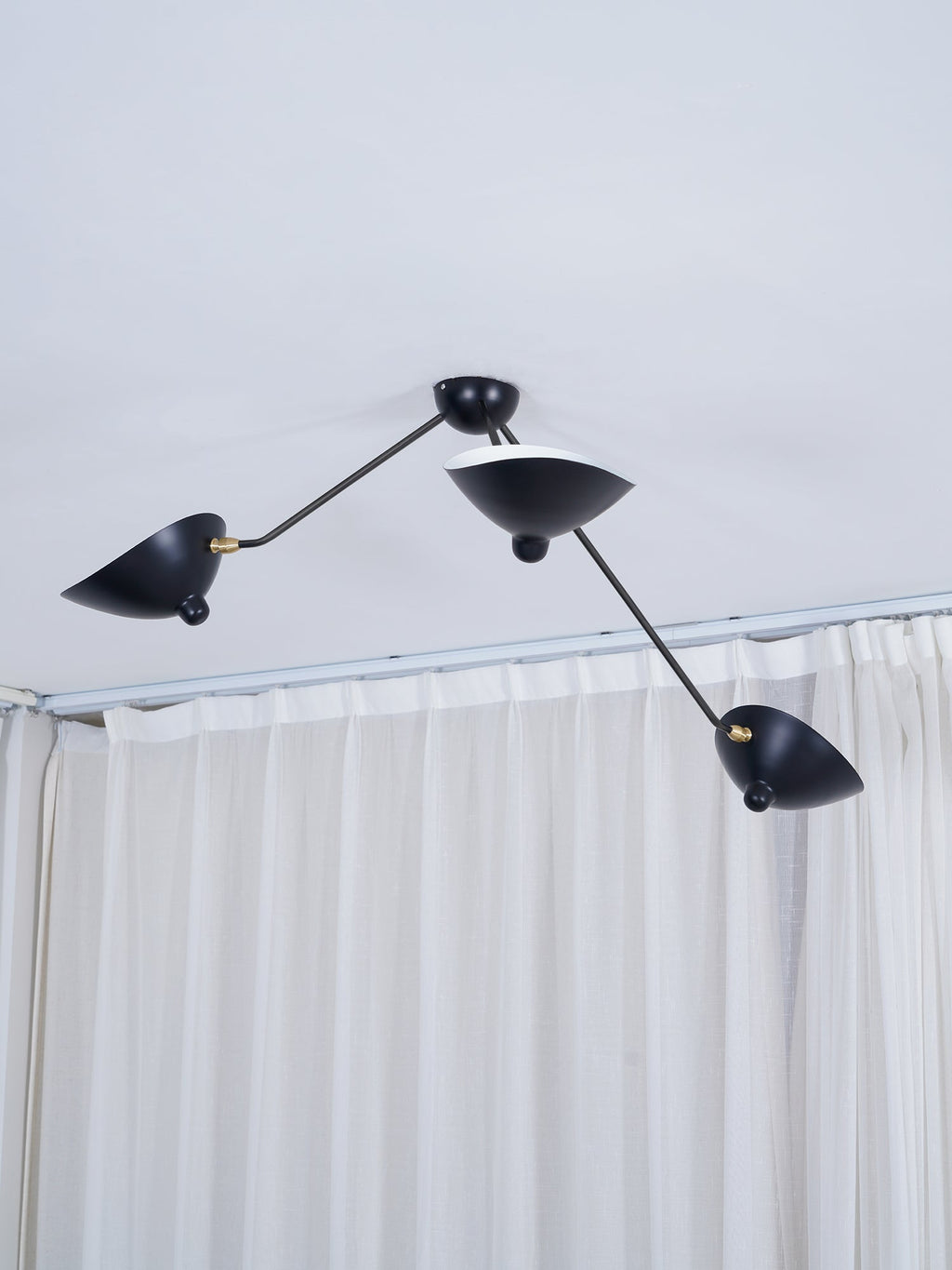 Multi-arm spider ceiling light shown straight on