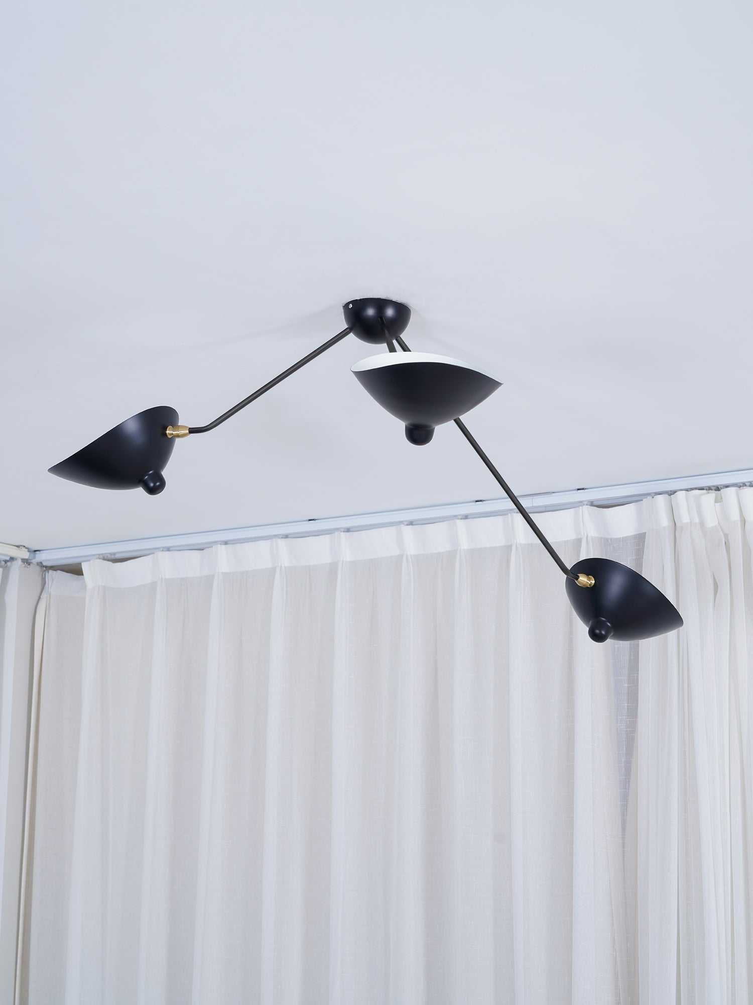 Multi-arm spider ceiling light shown straight on