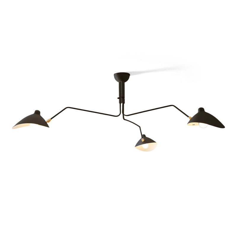 Multi-arm spider ceiling light with reflector shades in a room