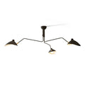 Multi-arm spider ceiling light with reflector shades in a room