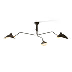 Multi-arm spider ceiling light with reflector shades in a room