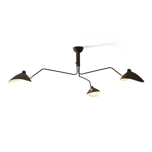 Multi-arm spider ceiling light with reflector shades in a room