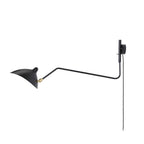 Plug-in wall sconce with long swing-arm reaching across the room
