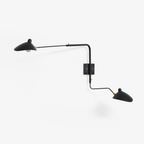 White spider wall sconce with rotating shade on slim arm