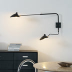 Two-arm wall sconce mounted high on an interior wall