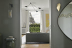 Spider ceiling light lit warmly above a lounge