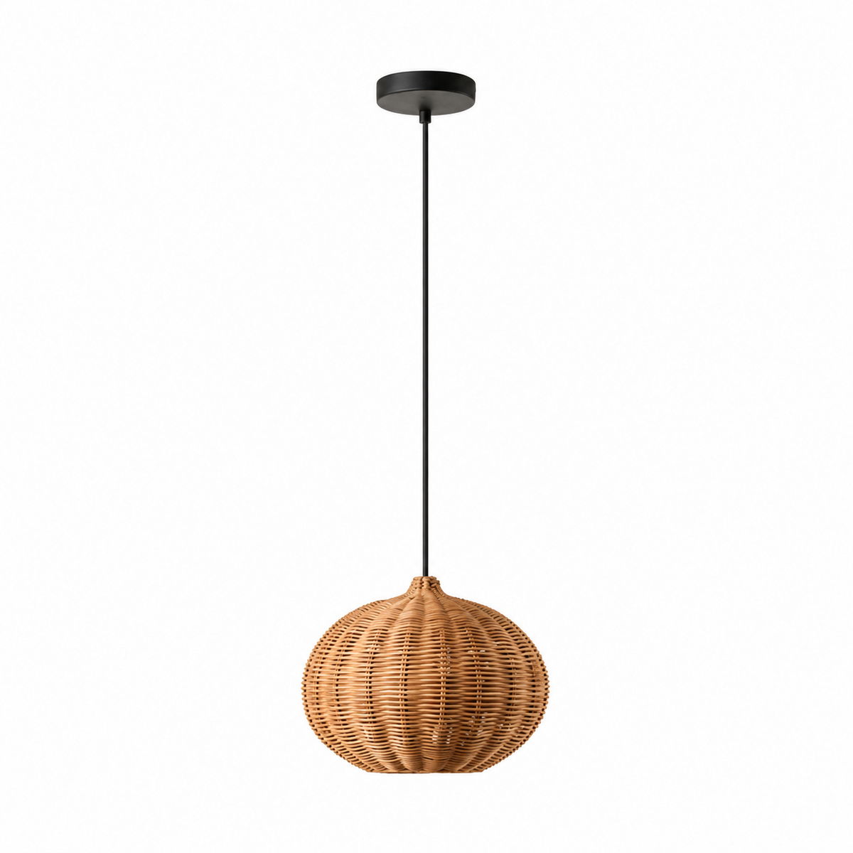 A pumpkin-round rattan Clérachic shade sits unlit against a plain white backdrop, showing its hand-woven texture.
