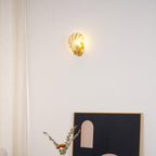 Shown once more above the side table, this Clérachic wall light's glow softly lights the arched print below.