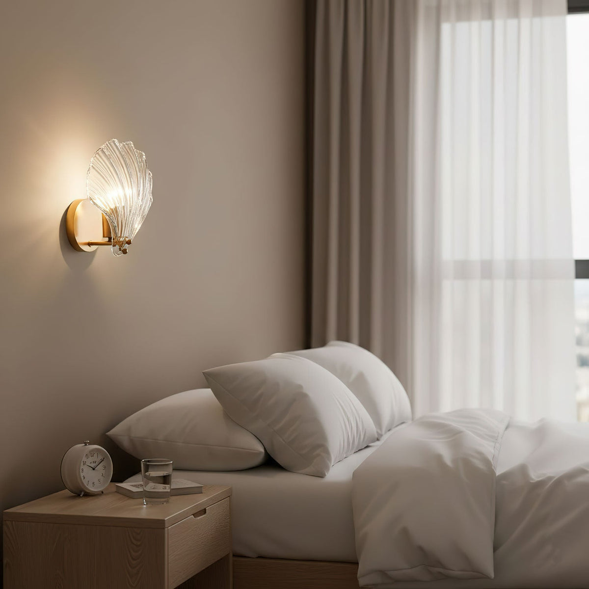 Mounted between sheer-curtained windows, this Clérachic wall light glows softly above a bedside table with an alarm clock.