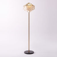 A small full-length product view of this Clérachic floor lamp against a plain grey backdrop.