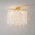 Mounted flush to a plain ceiling, this Clérachic ceiling light in silver glows warm through its clear glass discs.