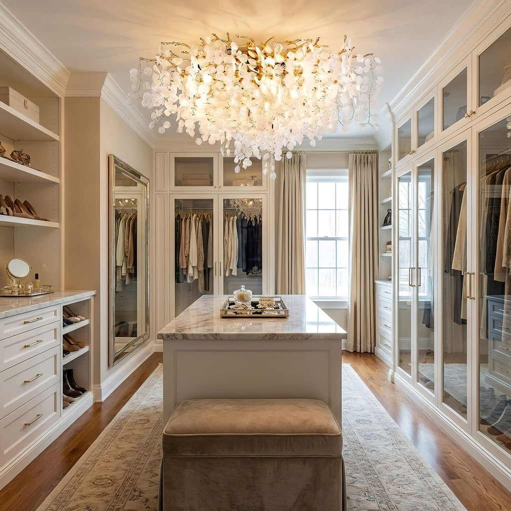 Mounted in a walk-in closet with mirrored wardrobes, this Clérachic ceiling light casts a soft glow over a centre island and bench.