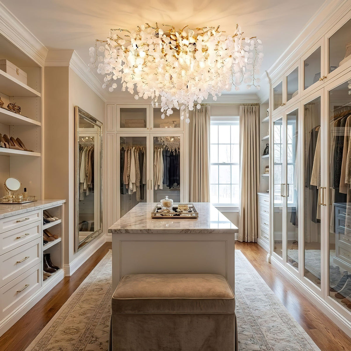 Mounted in a walk-in closet with mirrored wardrobes, this Clérachic ceiling light casts a soft glow over a centre island and bench.