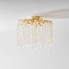 Viewed from below on a plain white background, this Clérachic ceiling light shows its mounting plate and gold branches.