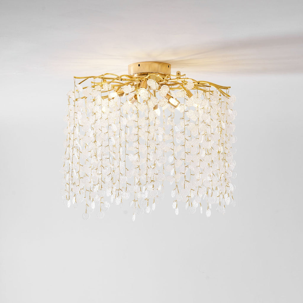 From a different low angle, this Clérachic ceiling light shows its mounting plate and cascading frosted glass discs on white.
