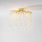 From a different low angle, this Clérachic ceiling light shows its mounting plate and cascading frosted glass discs on white.