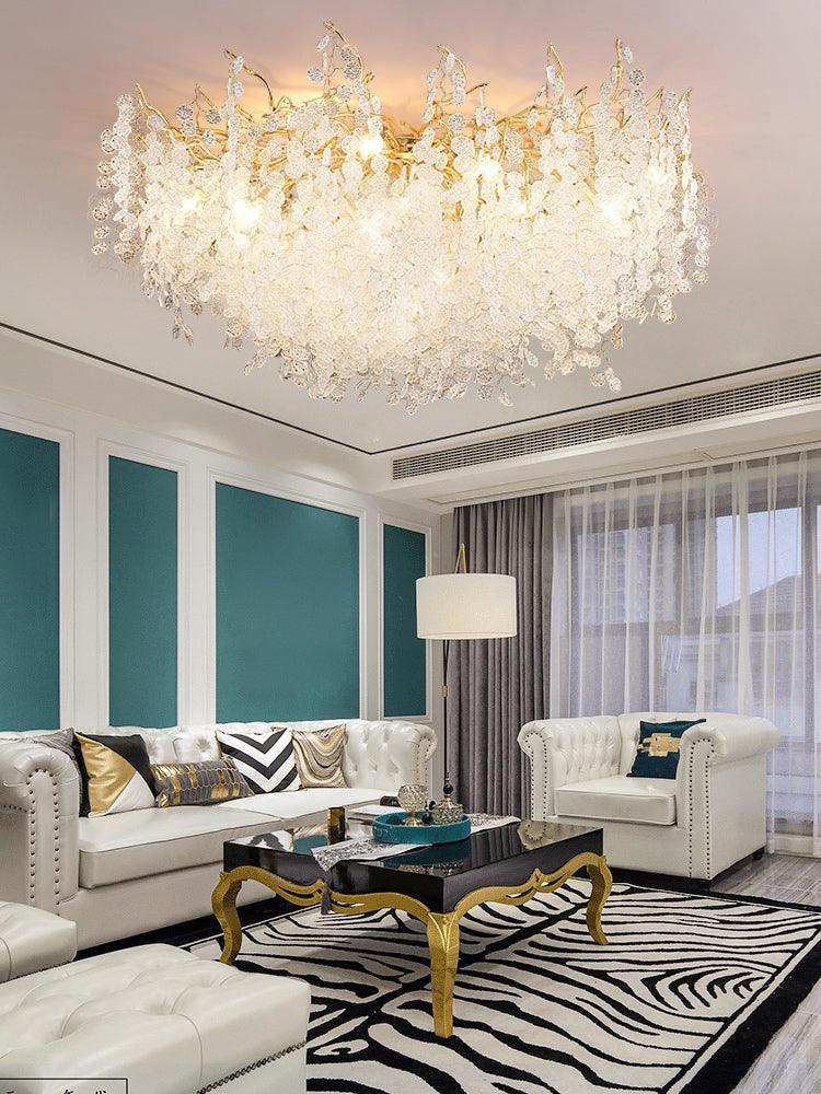 In a living room with teal striped walls and sheer curtains, this Clérachic ceiling light glows above two white tufted sofas on a zebra-print rug.
