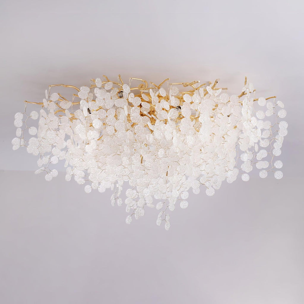 Close view of this Clérachic ceiling light's gold branches and frosted glass discs, unlit against a plain grey backdrop.