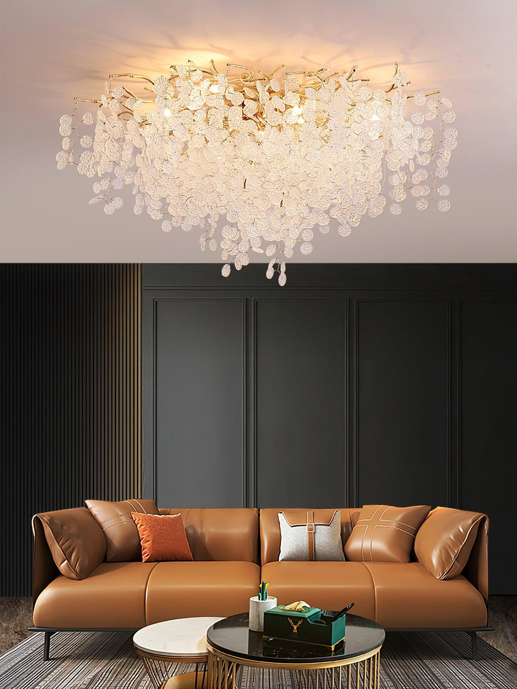 This Clérachic ceiling light is shown in close-up above a styled photo of a dark green living room with an orange leather sofa.