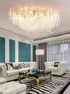 This Clérachic ceiling light glows above a black-and-gold coffee table in a living room with teal striped walls and a zebra rug.