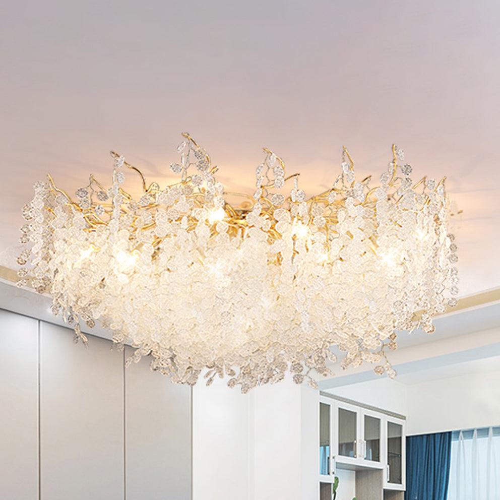 Close view from below of this Clérachic ceiling light, showing the gold branches threaded with frosted glass discs.