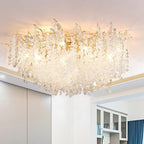 Viewed from a lower angle, this Clérachic ceiling light glows warmly beside sliding closet doors and crown moulding.