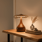 Amber glass table lamp shown from above with warm glow