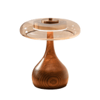 Walnut base table lamp glowing softly in an evening room