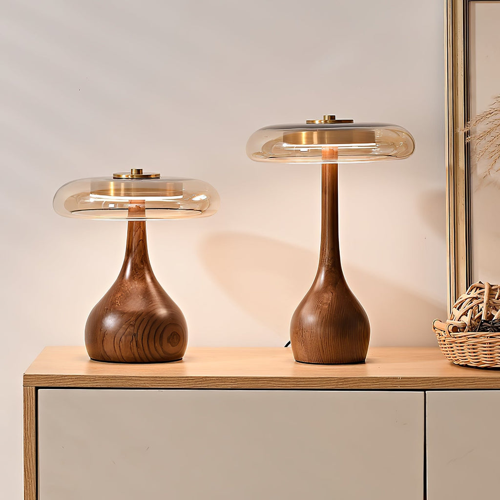 Amber glass table lamp casting warm light across a surface