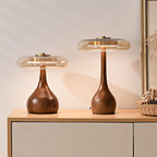 Amber glass table lamp casting warm light across a surface