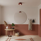 Resin ceiling light with stacked forms in a styled space