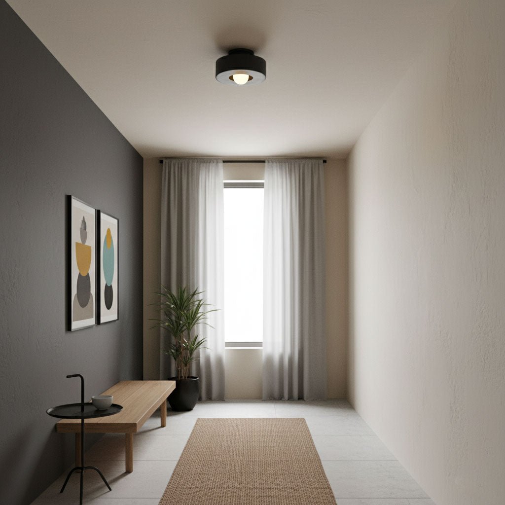 Sculptural stacked ceiling light glowing softly above a room