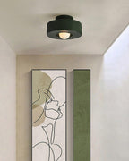 Stacked cylinder ceiling light detail in a soft neutral setting